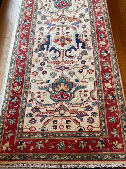 Pakistani Heriz Runner, 2'8" x 14'6", in green, ivory, navy and red