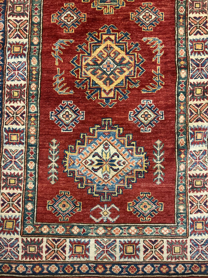 Afghan Kazak Runner, 2'8" x 20'6", in gold, ivory, navy and red