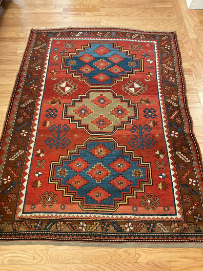 Antique Russian Kazak Rug, 4'7" x 7'6", in blue, brown, ivory and rust