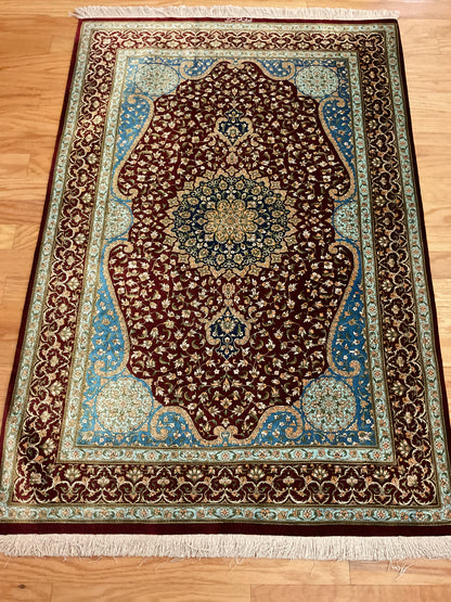 Persian Ghom Silk Rug, 3'4" x 5'10", in blue, burgundy, gold and ivory