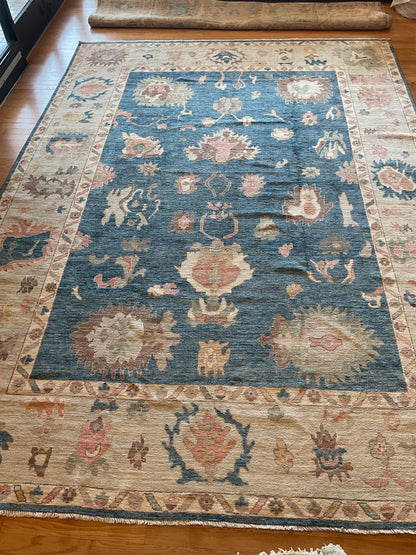 Afghan Oushak Rug, 10' x 14', in beige, blue, brown and peach