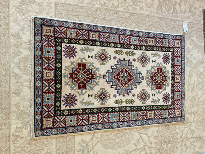 Pakistani Kazak Rug, 2'7" x 4'3", in blue, burgundy, hunter green and ivory