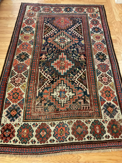 Antique Russian Kazak Rug, 4'7" x 7'3", in ivory, navy, red and rust