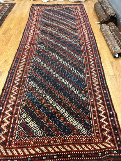 Persian Kurdish Runner, 4'9" x 11'9", in brown, ivory, navy and red