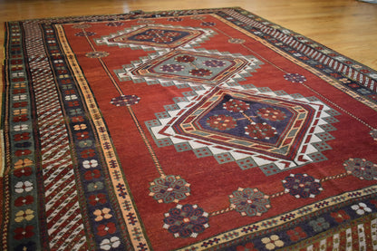 Antique Russian Kazak Rug, 5'9" x 8'5", in brown, green and red