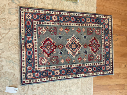 Pakistani Kazak Rug, 2'8" x 3'10", in blue, grey, ivory and red