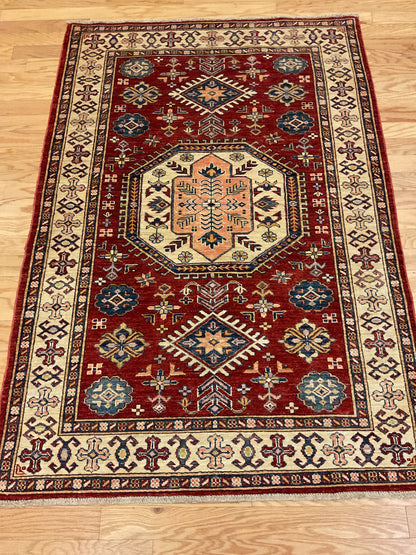 Afghan Kazak Rug, 4'1" x 6', in ivory, navy and red
